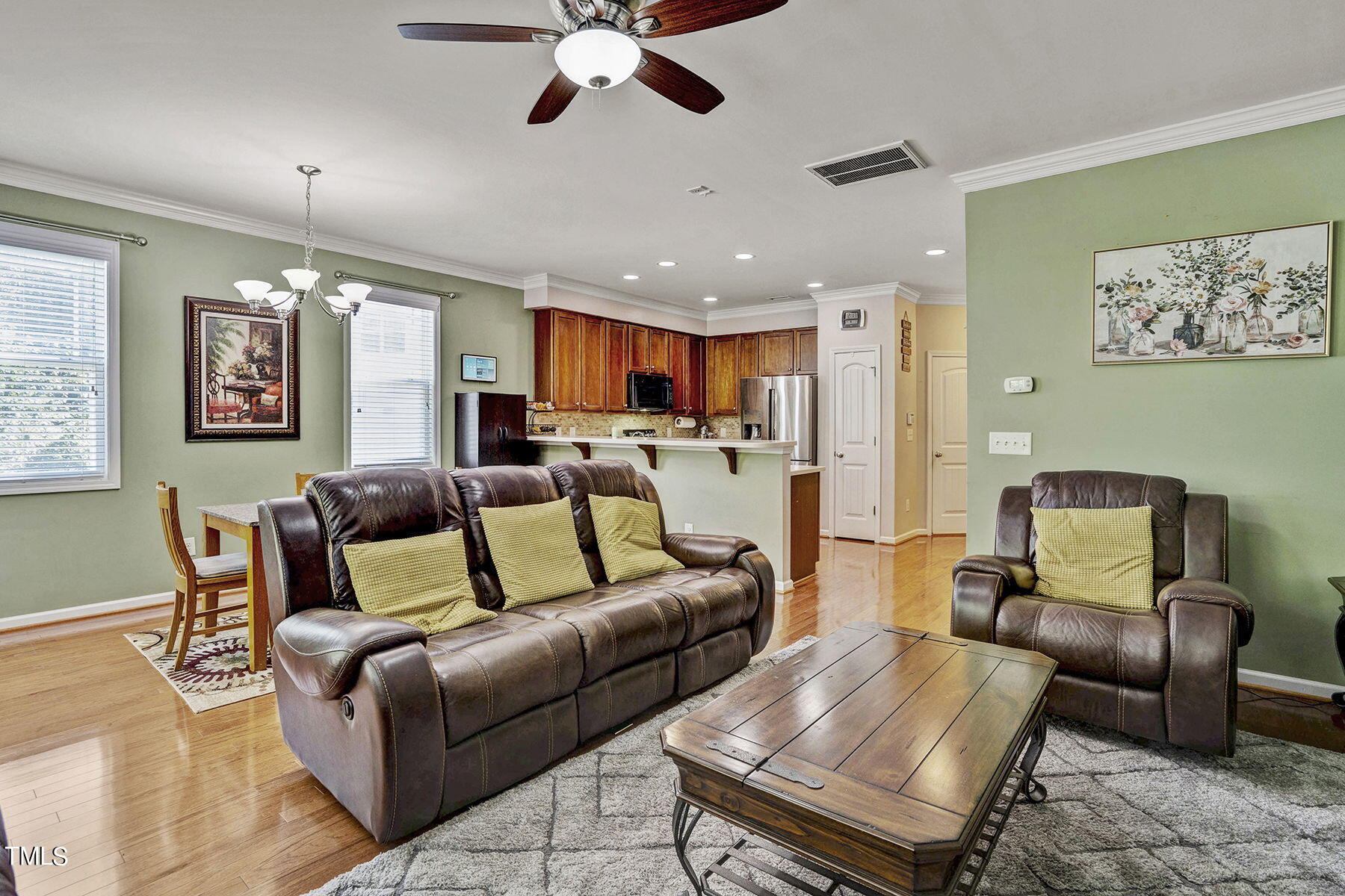 4630 Altha Street Raleigh, NC 27606 - Photo 6 of 31 a living room with furniture and a chandelier