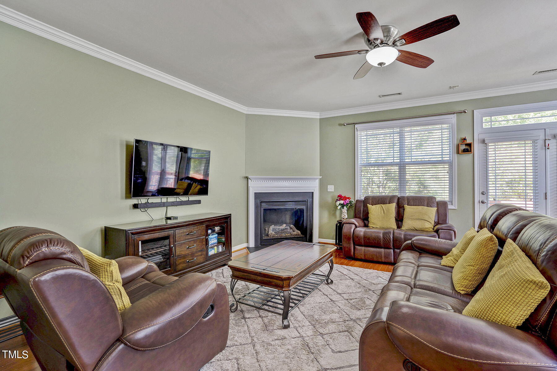 4630 Altha Street Raleigh, NC 27606 - Photo 7 of 31 a living room with furniture fireplace and a flat screen tv