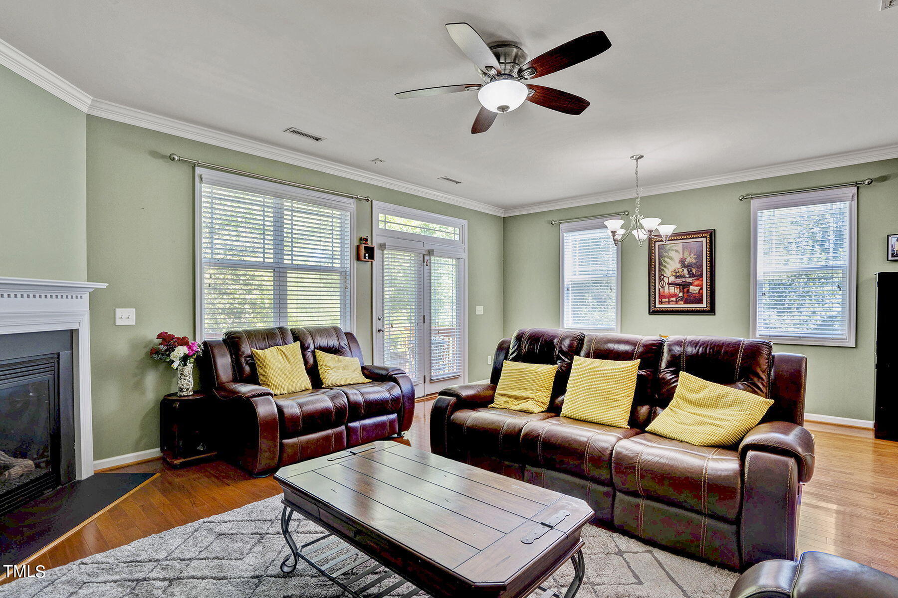 4630 Altha Street Raleigh, NC 27606 - Photo 9 of 31 a living room with furniture ceiling fan and a window