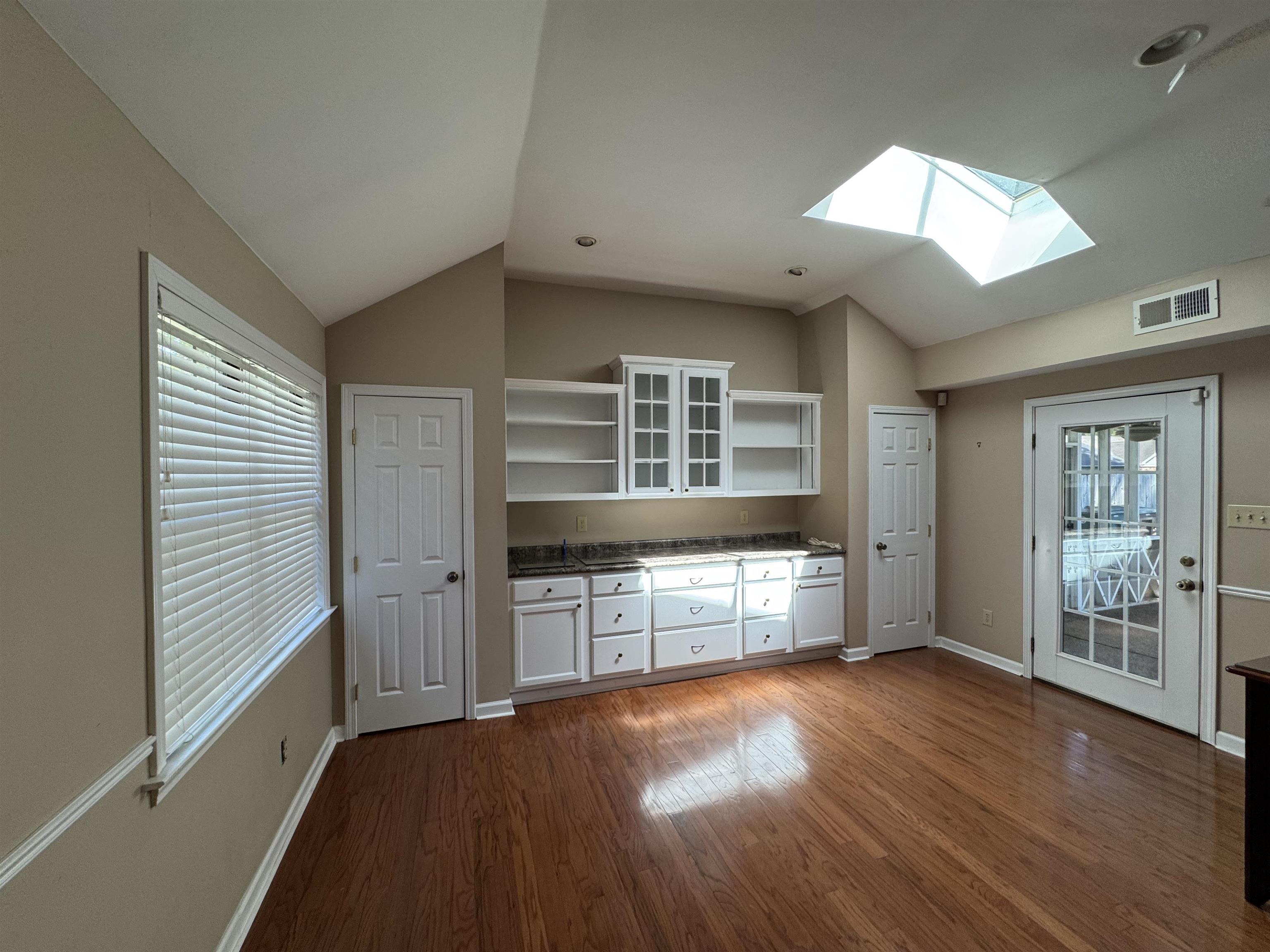 4118 Luther Road Bartlett, TN 38135 - Photo 3 of 10 Bonus room featuring lofted ceiling, a skylight, and dark wood-style floors