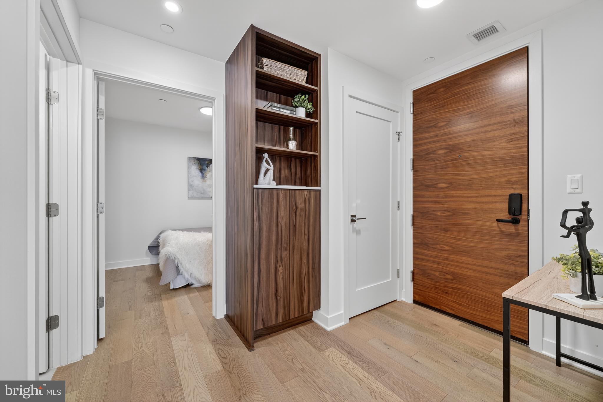 37 L Street Southeast, Unit A701 Washington, DC 20003 - Photo 17 of 45 a view of room with wooden floor and closet