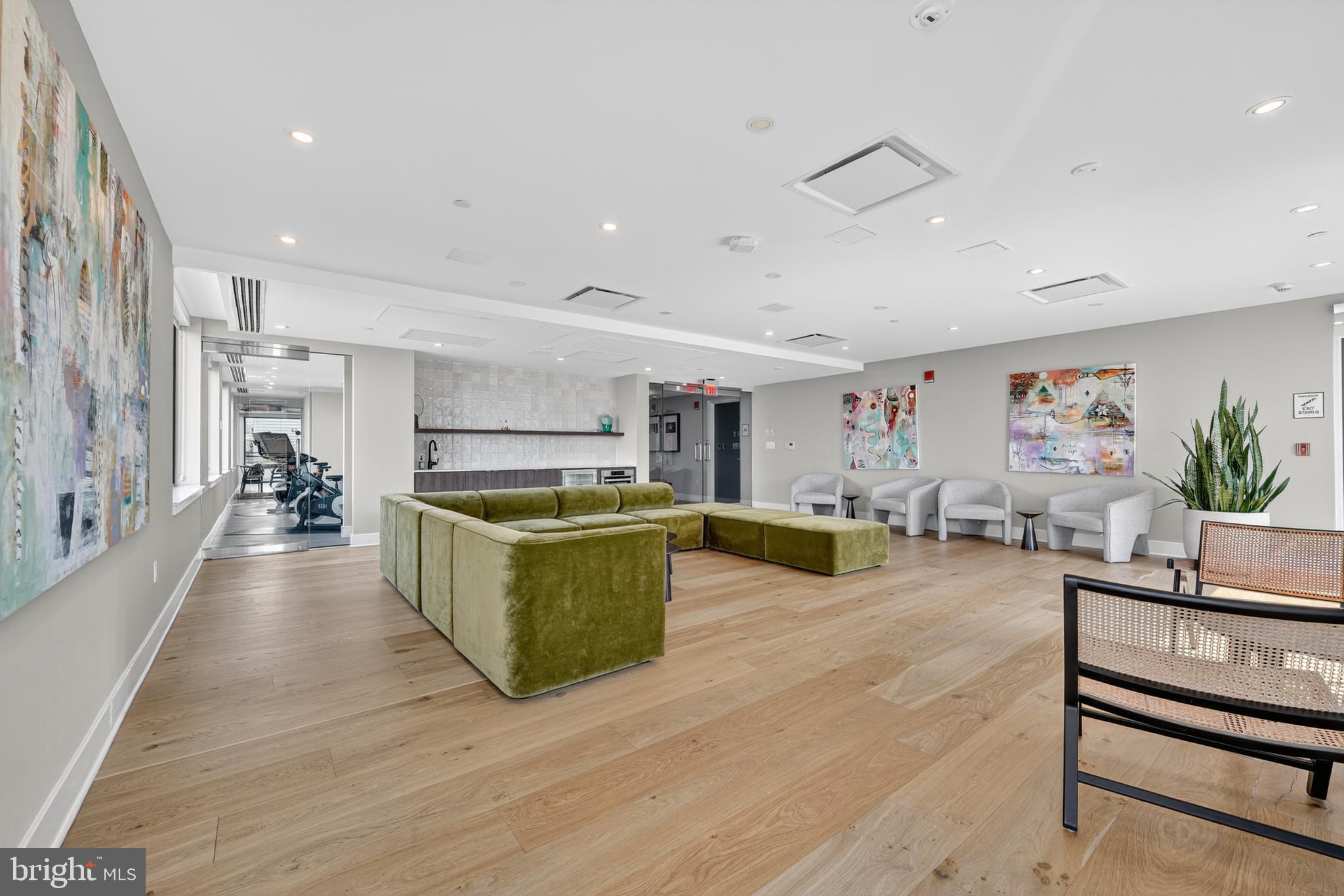 37 L Street Southeast, Unit A701 Washington, DC 20003 - Photo 23 of 45 a living room with furniture and a wooden floor