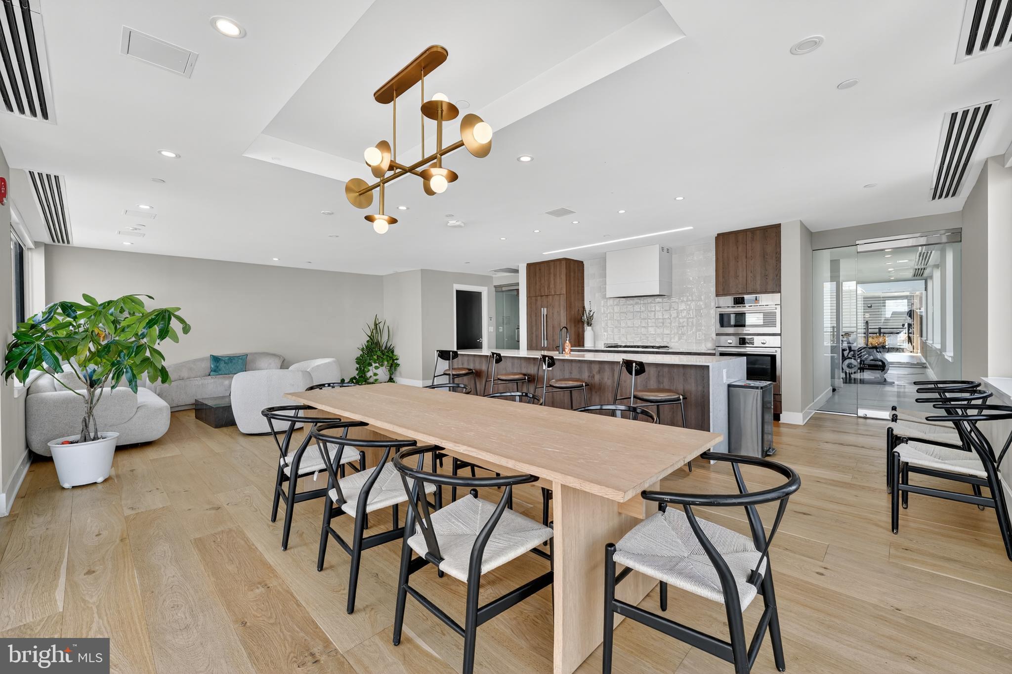 37 L Street Southeast, Unit A701 Washington, DC 20003 - Photo 26 of 45 a view of a dining room with furniture and a potted plant