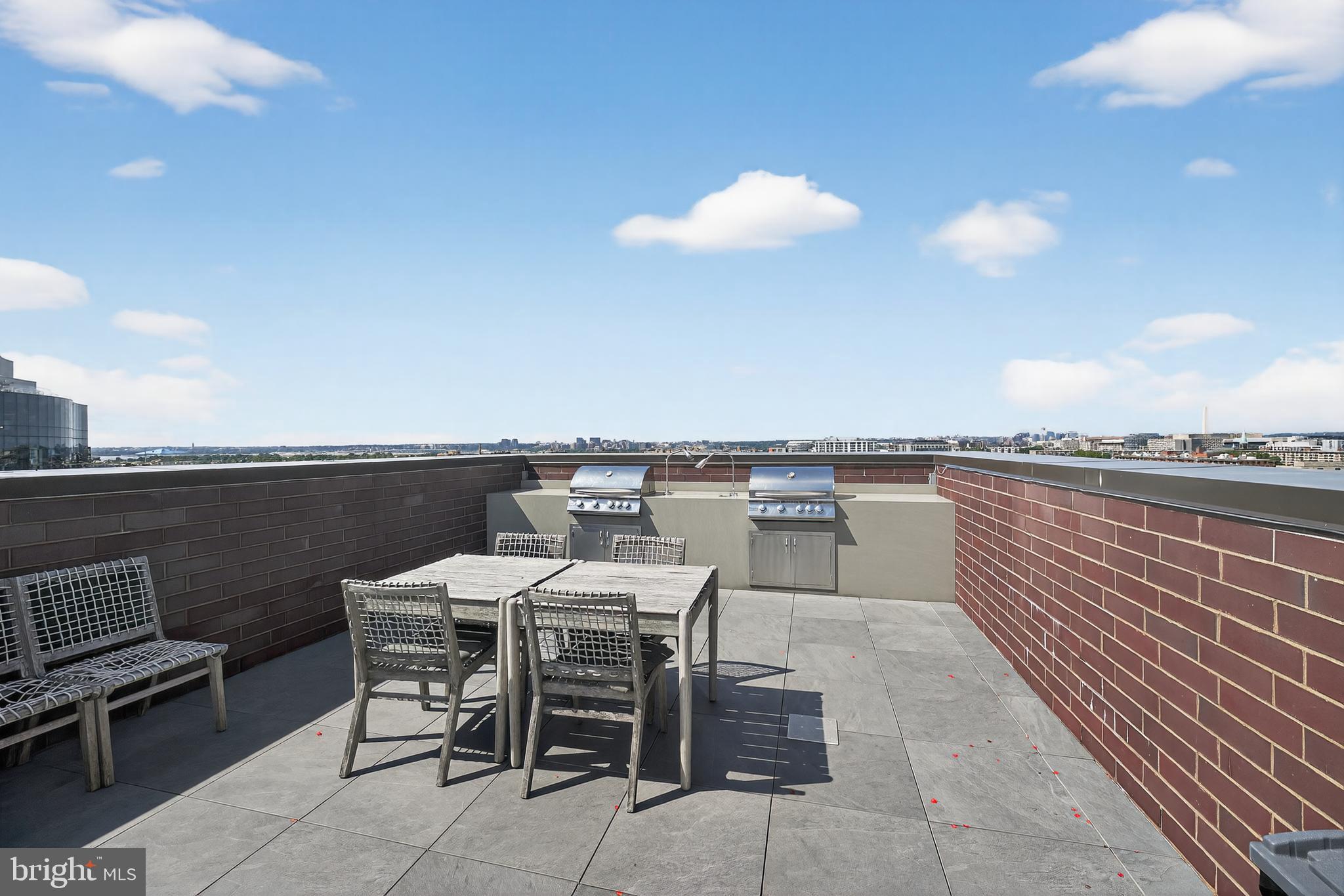 37 L Street Southeast, Unit A701 Washington, DC 20003 - Photo 30 of 45 a view of a terrace with furniture and stove