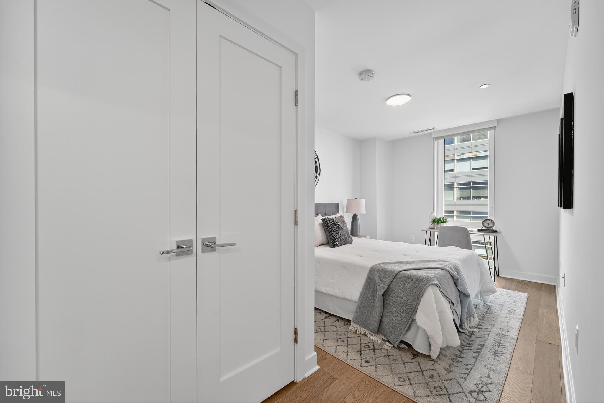 37 L Street Southeast, Unit A701 Washington, DC 20003 - Photo 9 of 45 a room with a bed and a window