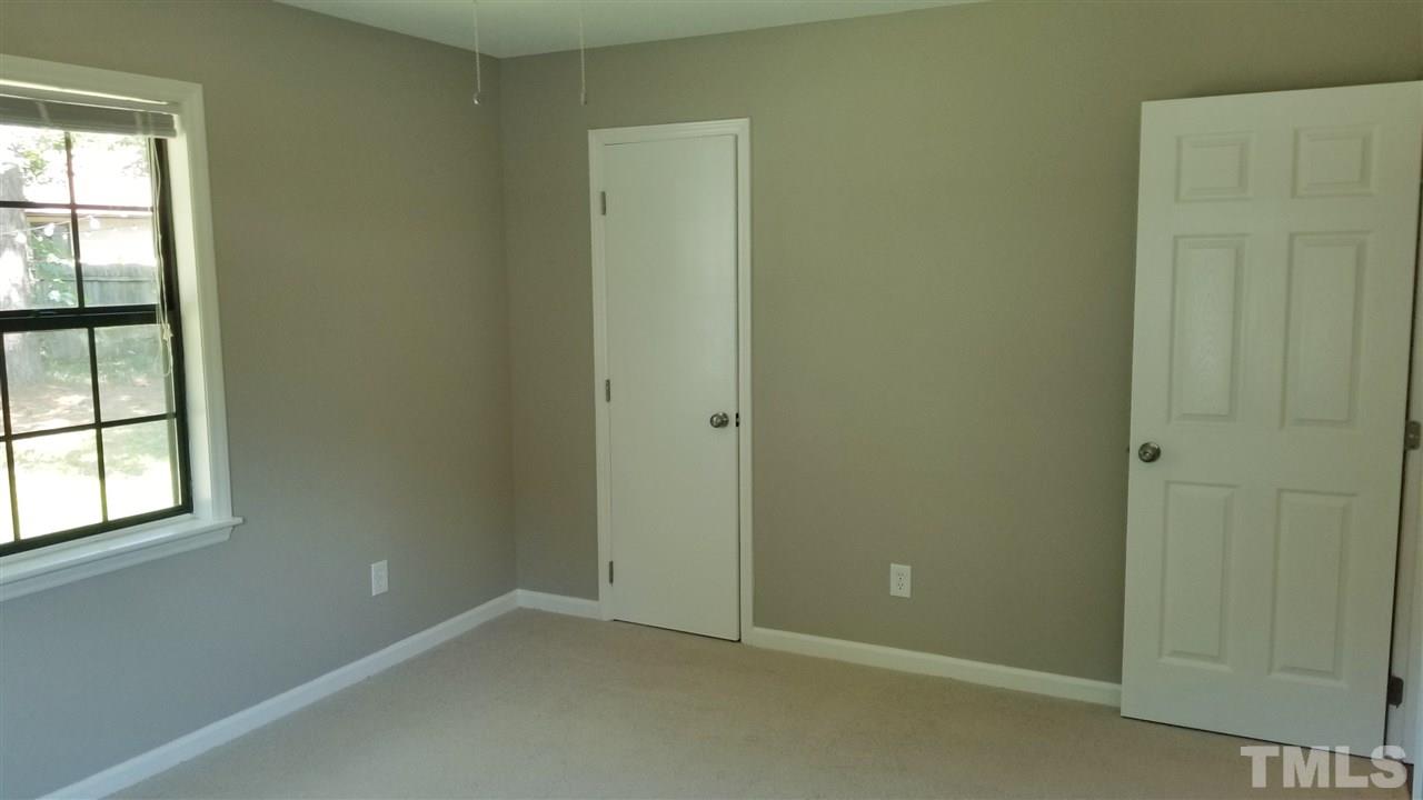 810 Wyldewood Road Durham, NC 27704 - Photo 15 of 23 an empty room with windows