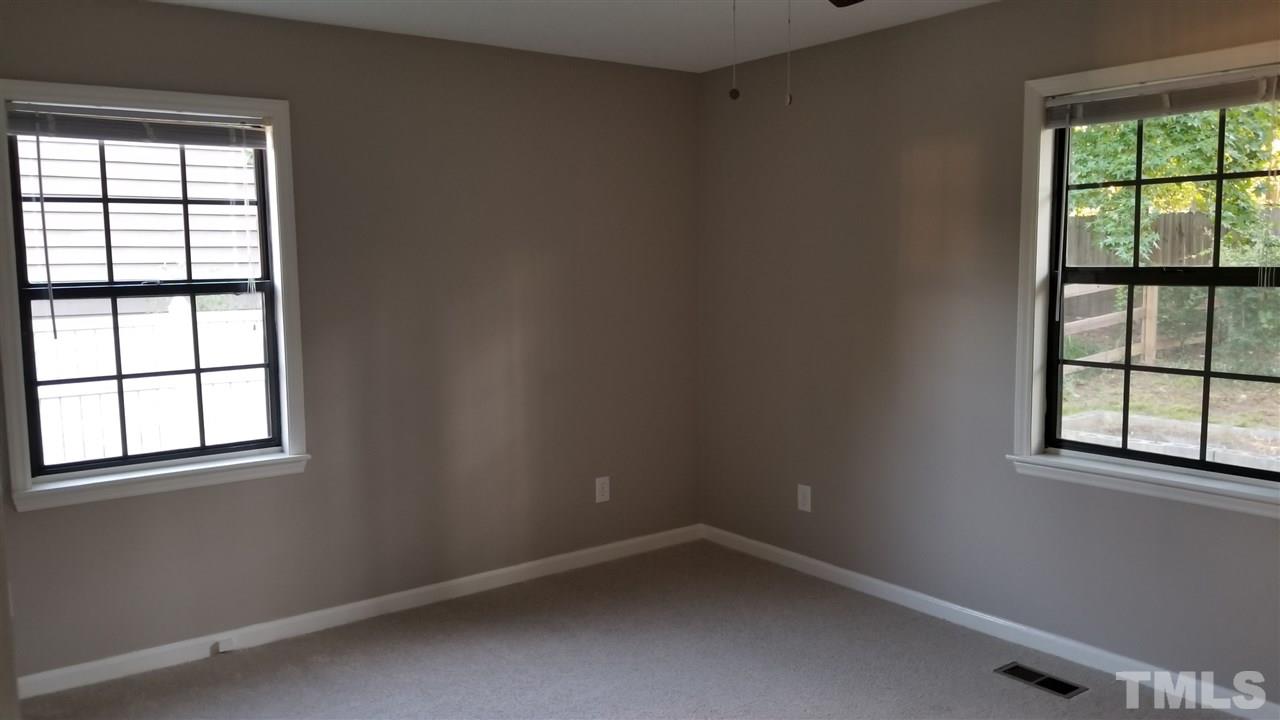 810 Wyldewood Road Durham, NC 27704 - Photo 16 of 23 an empty room with a window