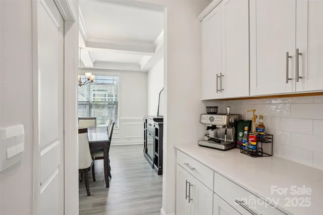 a kitchen with stainless steel appliances a sink and cabinets