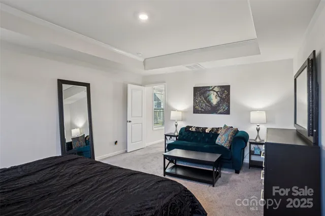 a bathroom with a granite countertop sink a mirror and a bathtub