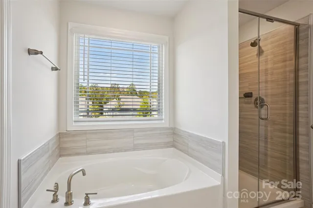 a en suite bathroom with a sink and a mirror