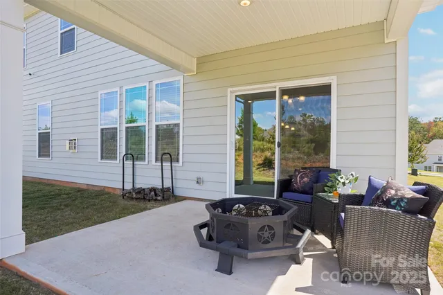 a view of a house with swimming pool and porch