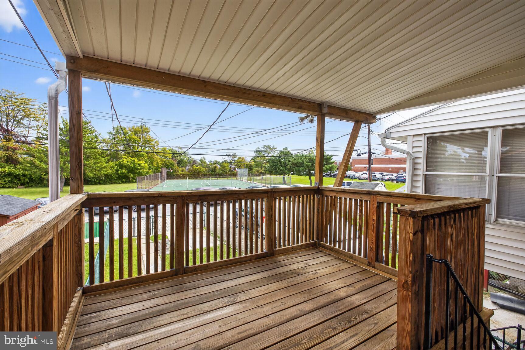 8258 Kavanagh Road Baltimore, MD 21222 - Photo 11 of 19 a view of balcony with wooden floor