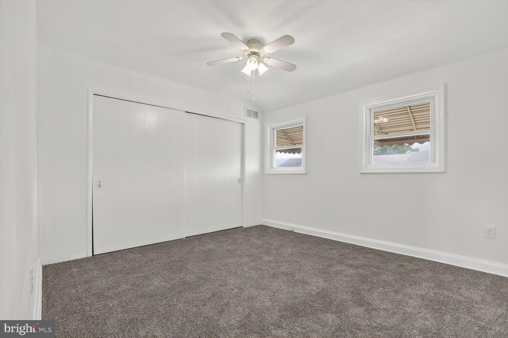 8258 Kavanagh Road Baltimore, MD 21222 - Photo 12 of 19 a view of an empty room with a fan