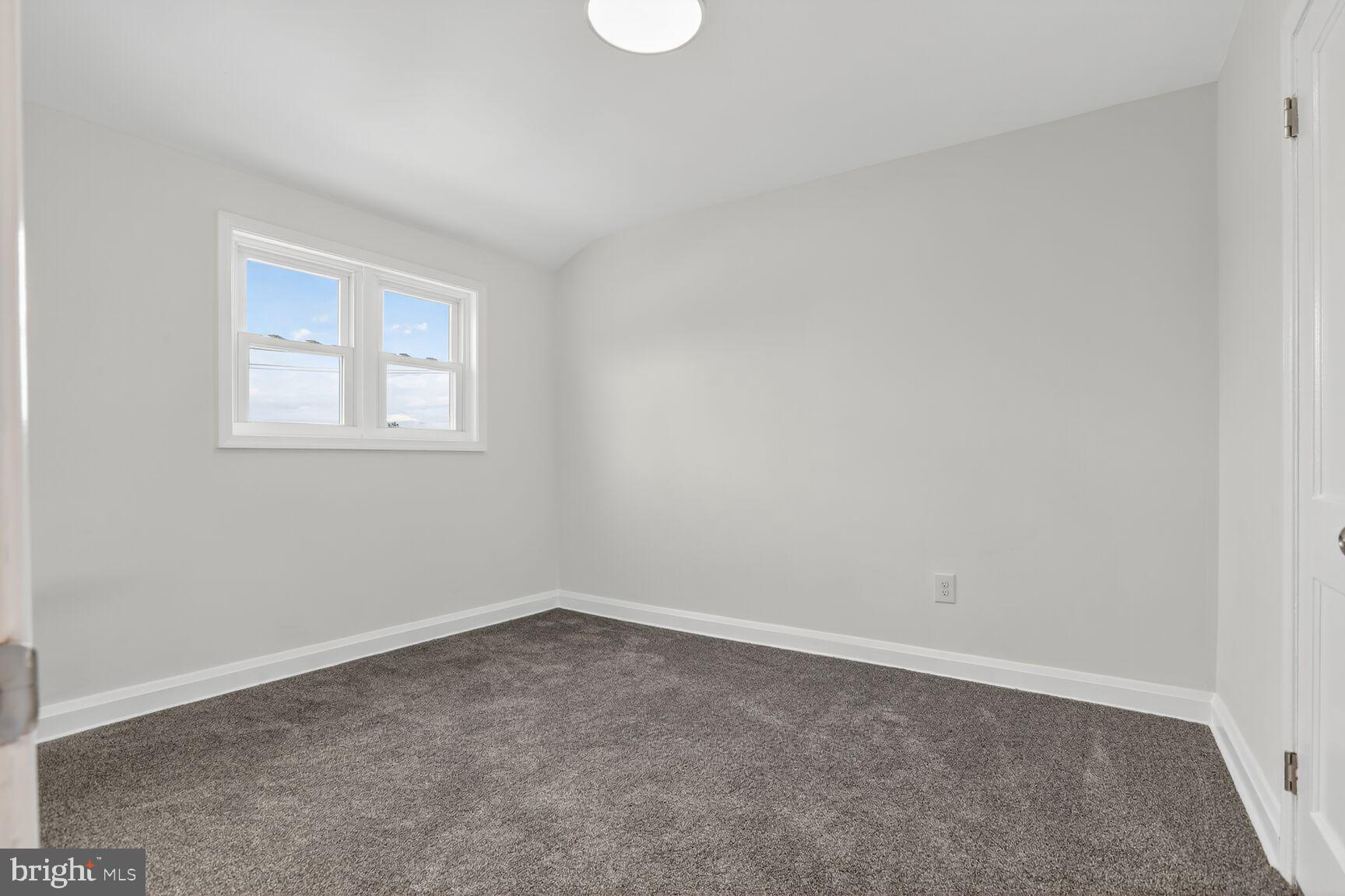 8258 Kavanagh Road Baltimore, MD 21222 - Photo 14 of 19 an empty room with a window