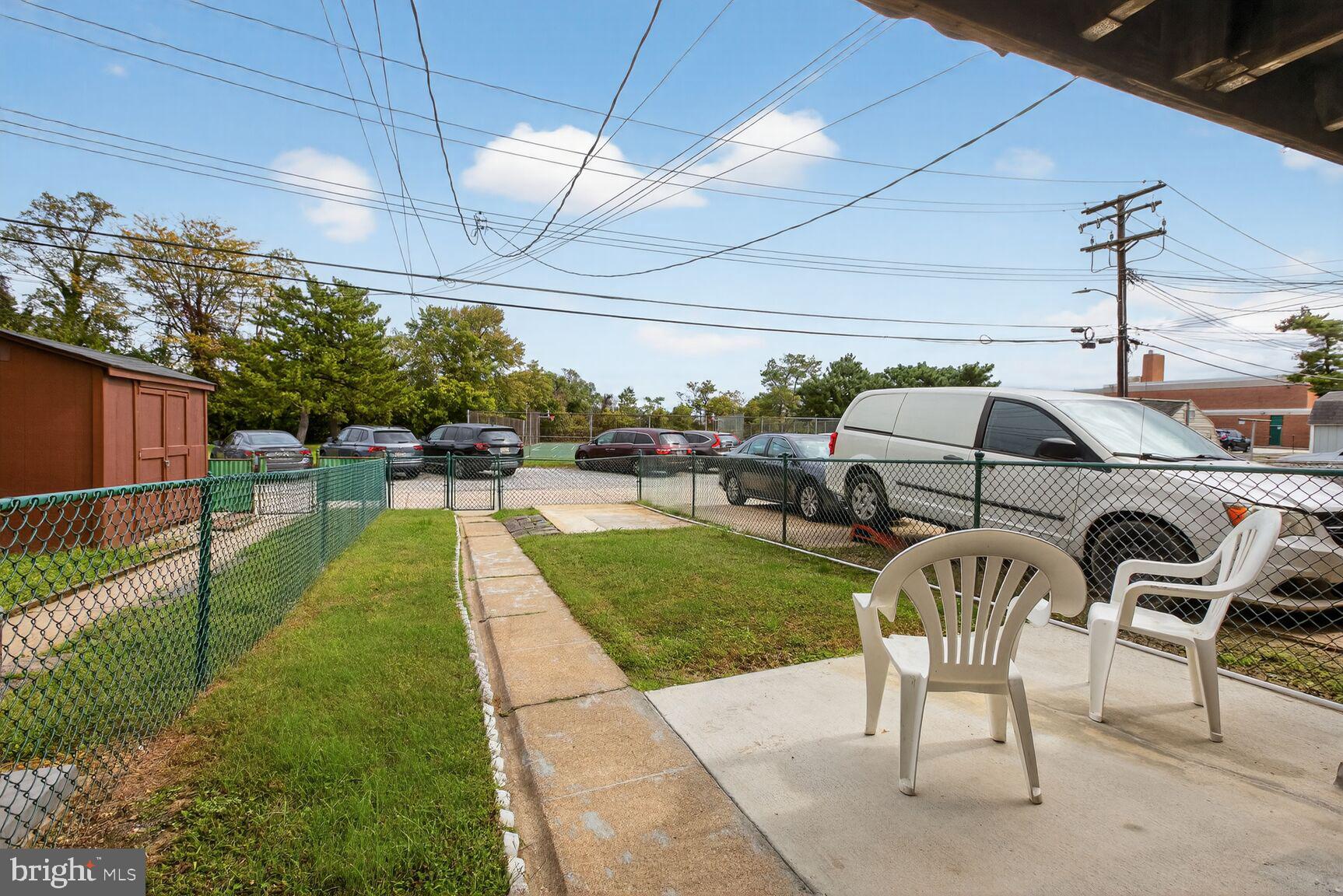8258 Kavanagh Road Baltimore, MD 21222 - Photo 2 of 19 a view of a porch with furniture and a yard