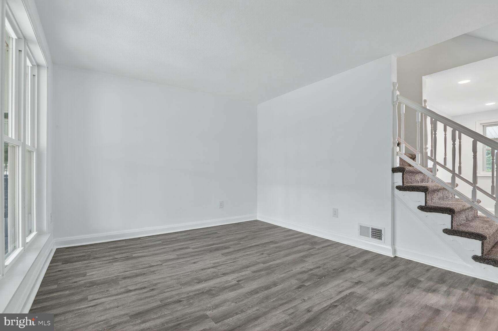 8258 Kavanagh Road Baltimore, MD 21222 - Photo 4 of 19 a view of an empty room with stairs