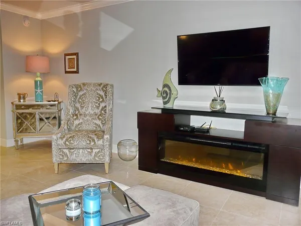 a living room with a couch and a flat screen tv