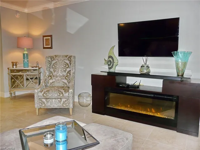 a living room with a couch and a flat screen tv