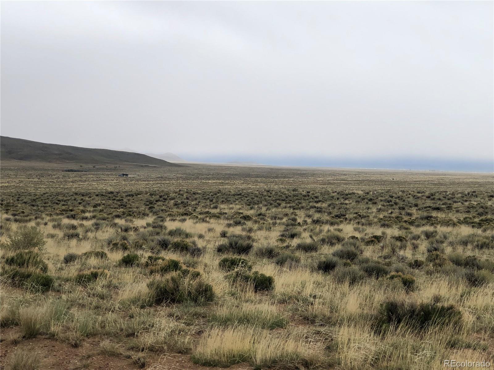 0 Russ Road Sanford, CO 81151 - Photo 15 of 15 an aerial view of houses covered in trees
