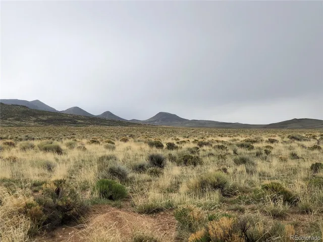 a view of mountain with lake view