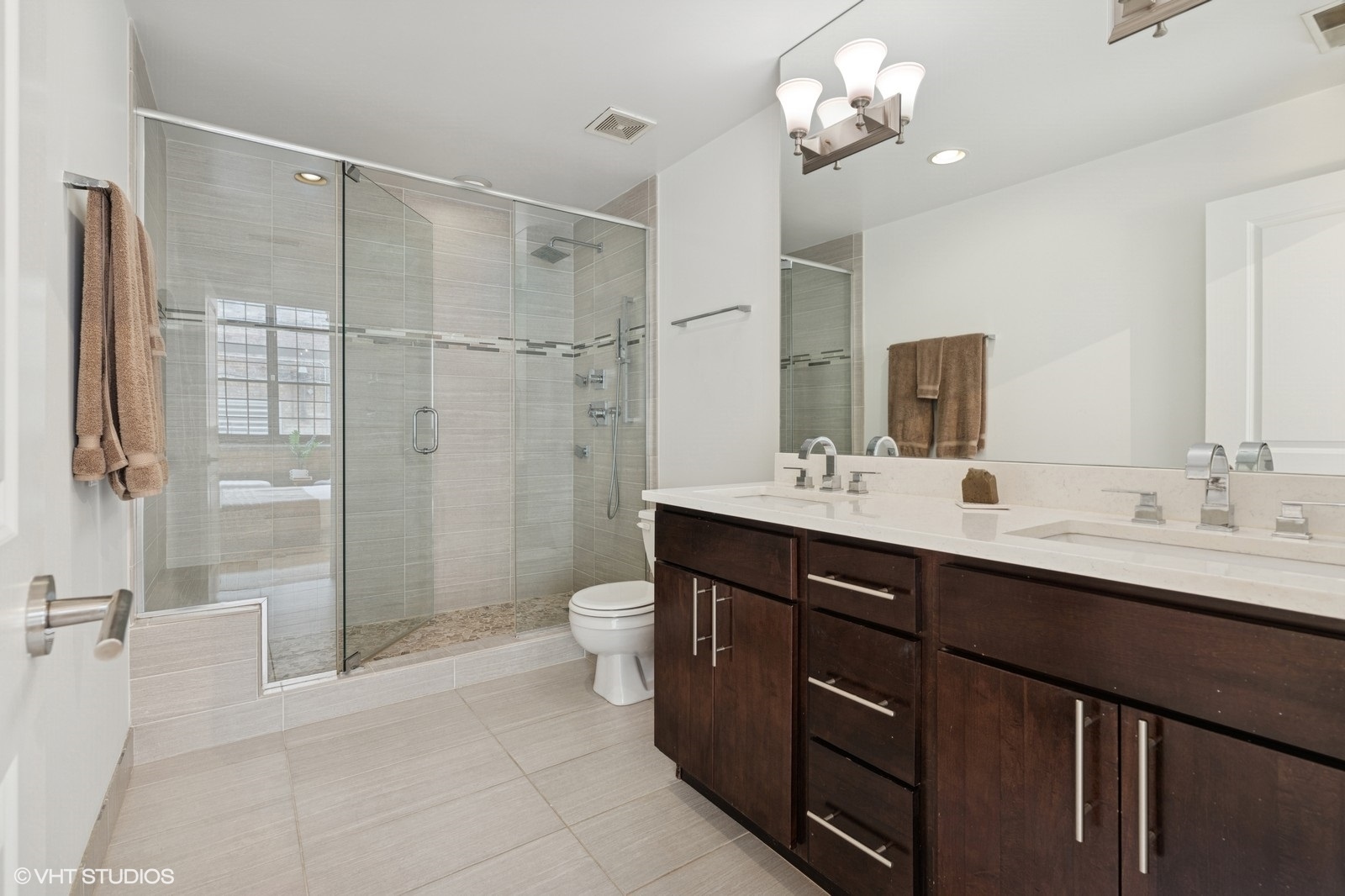 17 North Loomis Street, Unit 1C Chicago, IL 60607 - Photo 17 of 24 a bathroom with a double vanity sink mirror and toilet