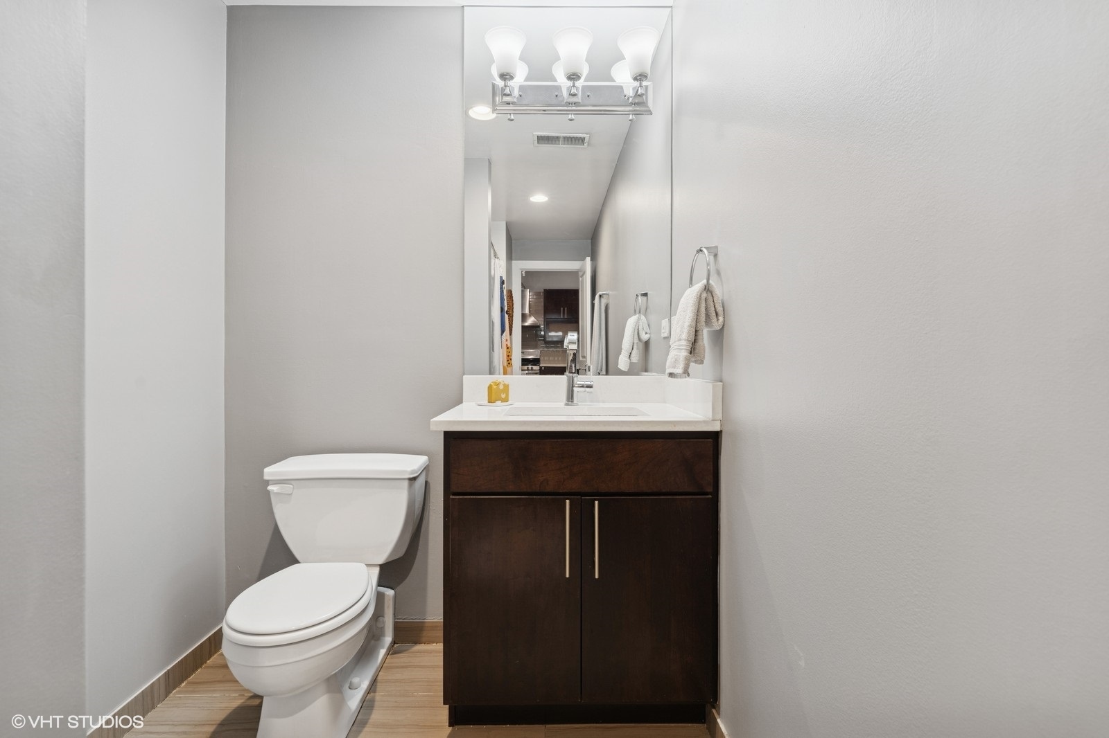 17 North Loomis Street, Unit 1C Chicago, IL 60607 - Photo 20 of 24 a bathroom with a toilet sink and mirror