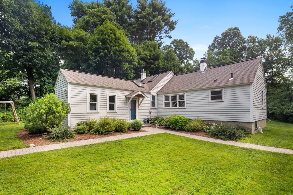 143 Boston Post Road Wayland, MA 01778 - Photo 1 of 17 a view of a backyard with potted plants and large tree