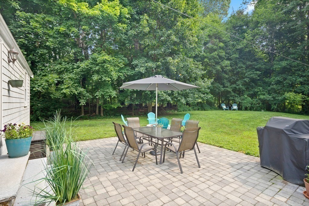 143 Boston Post Road Wayland, MA 01778 - Photo 16 of 17 a view of a chair and table in the garden