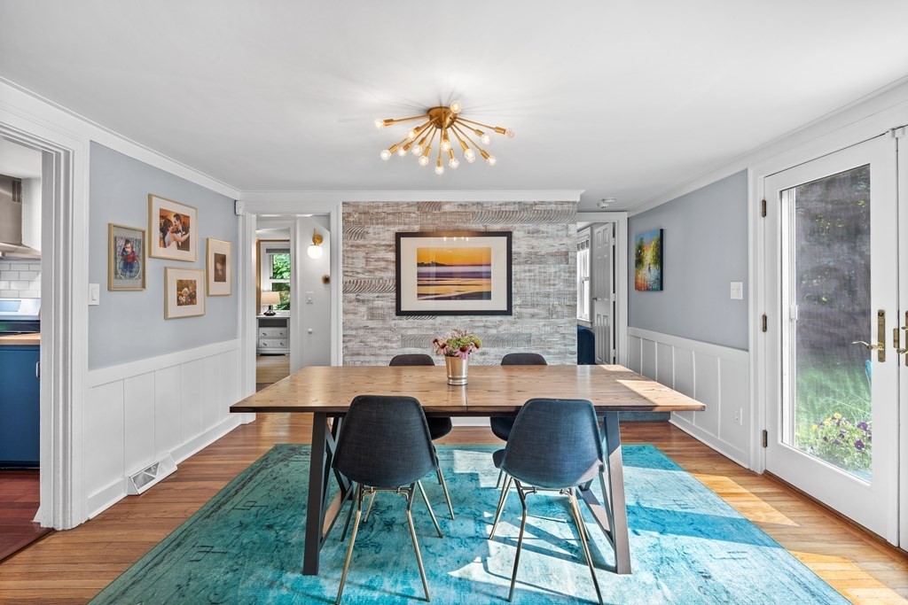 143 Boston Post Road Wayland, MA 01778 - Photo 2 of 17 a view of a dining room with furniture wooden floor and a rug