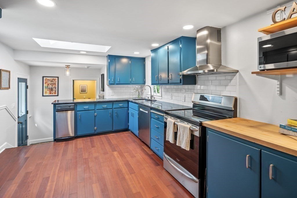 143 Boston Post Road Wayland, MA 01778 - Photo 5 of 17 a kitchen with stainless steel appliances granite countertop a stove and a sink
