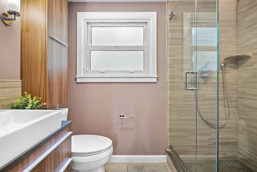 143 Boston Post Road Wayland, MA 01778 - Photo 8 of 17 a bathroom with a toilet a sink and shower