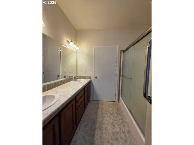a bathroom with a toilet a sink and a shower