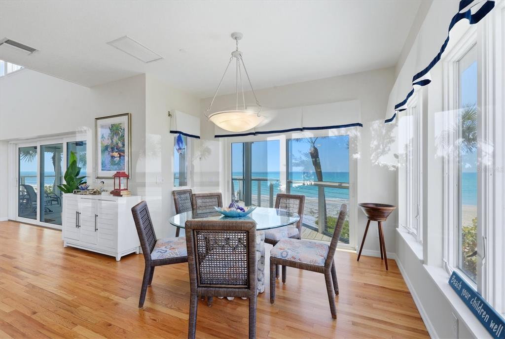 400 South Gulf Boulevard Boca Grande, FL 33921 - Photo 15 of 80 a dining room with furniture a chandelier and wooden floor