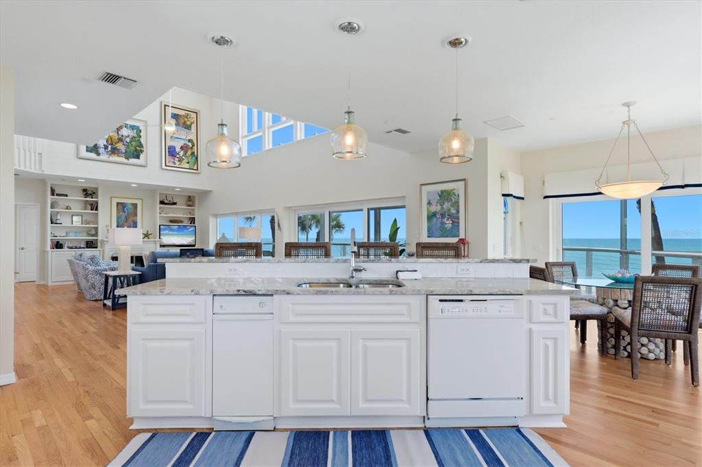 400 South Gulf Boulevard Boca Grande, FL 33921 - Photo 19 of 80 a kitchen with cabinets and wooden floor