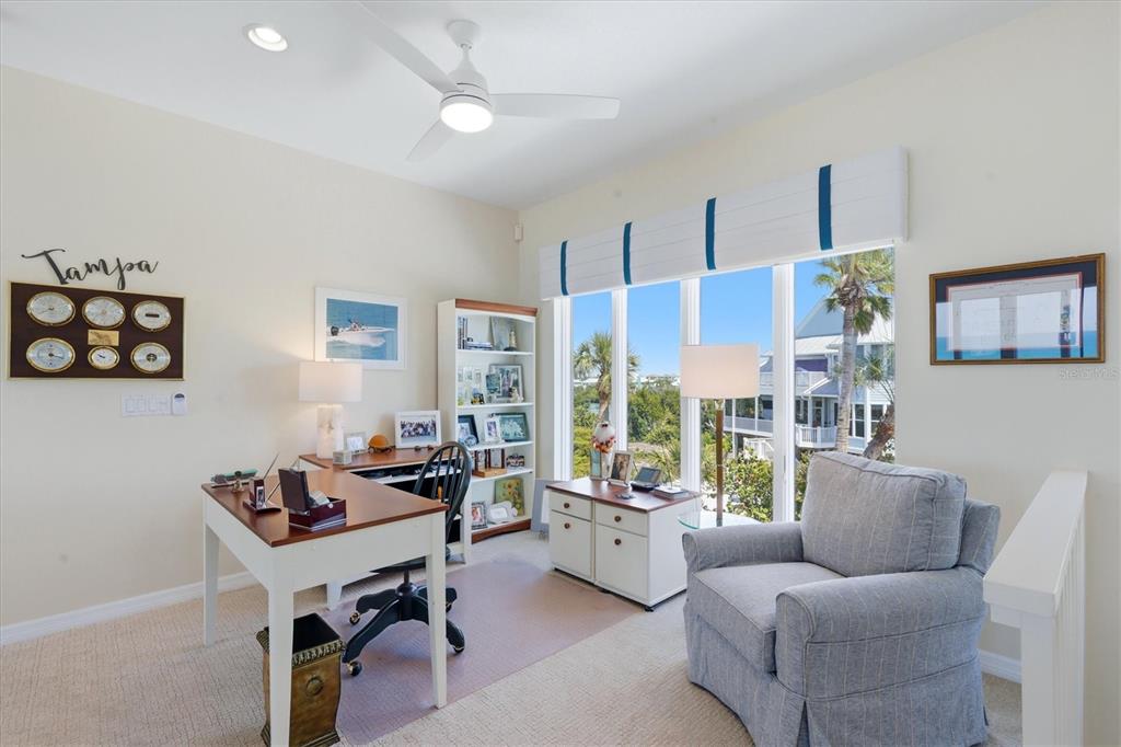400 South Gulf Boulevard Boca Grande, FL 33921 - Photo 25 of 80 a living room with furniture and a flat screen tv