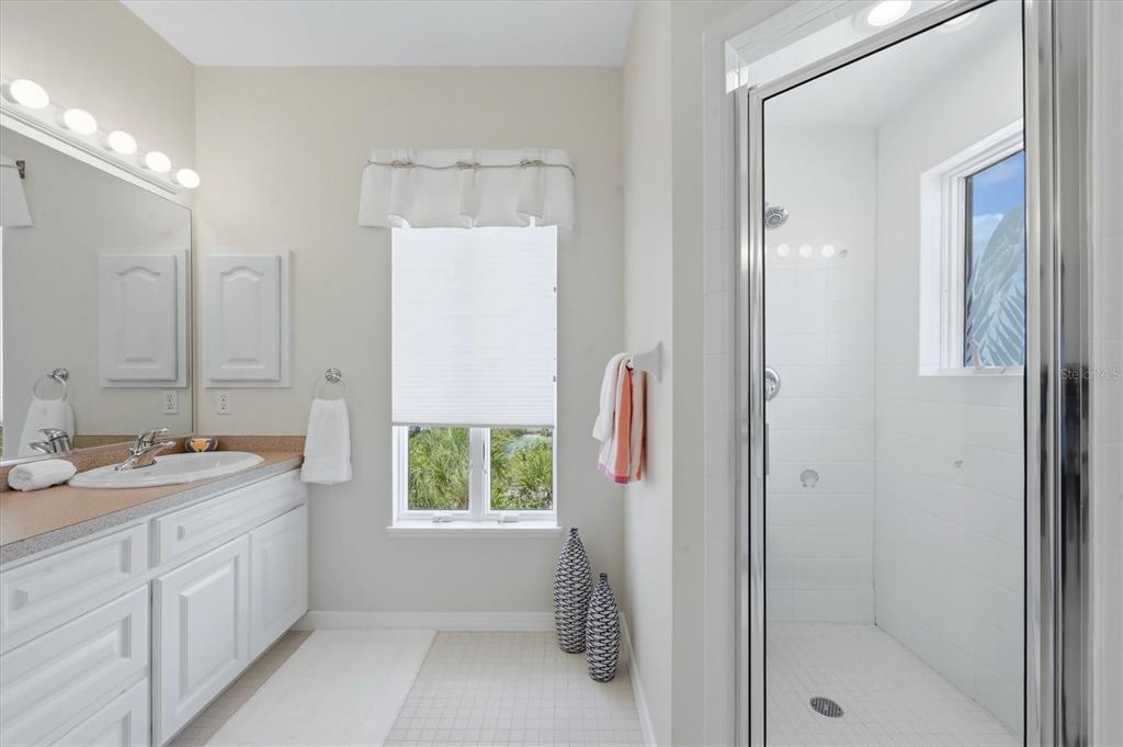 400 South Gulf Boulevard Boca Grande, FL 33921 - Photo 32 of 80 a bathroom with a double vanity sink and a mirror