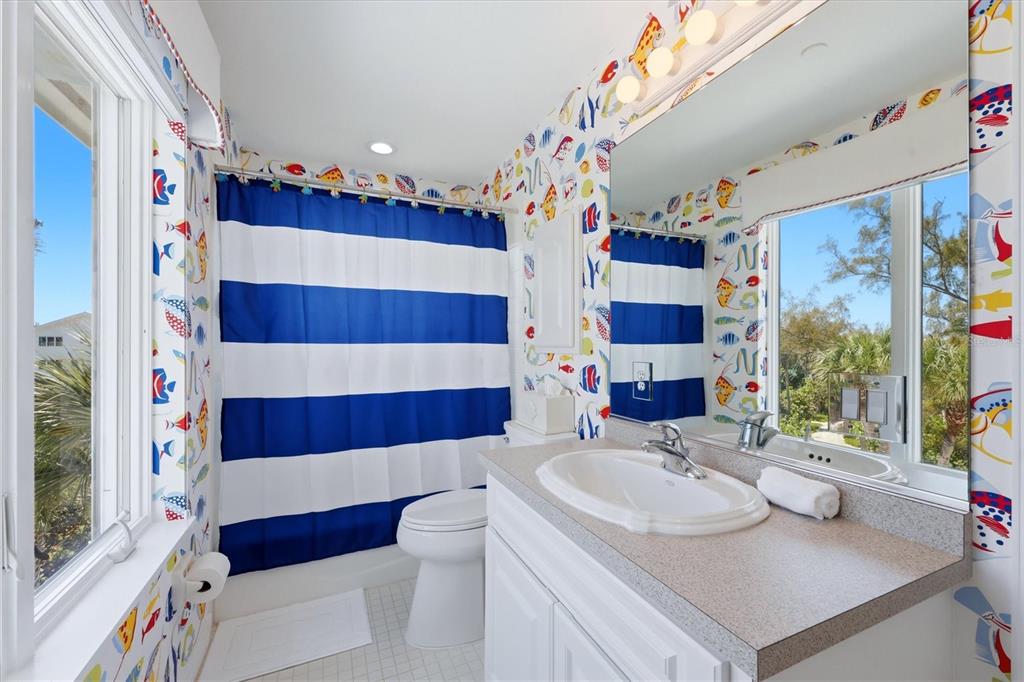 400 South Gulf Boulevard Boca Grande, FL 33921 - Photo 38 of 80 a bathroom with a sink and a mirror