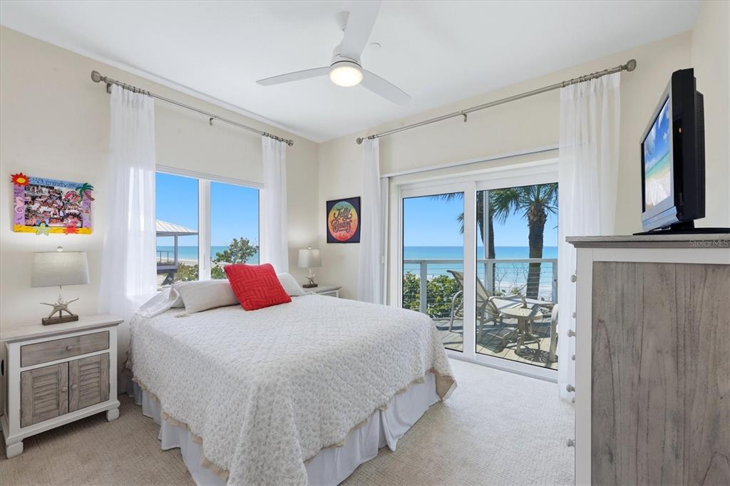 400 South Gulf Boulevard Boca Grande, FL 33921 - Photo 39 of 80 a bedroom with a bed flat screen tv and a window