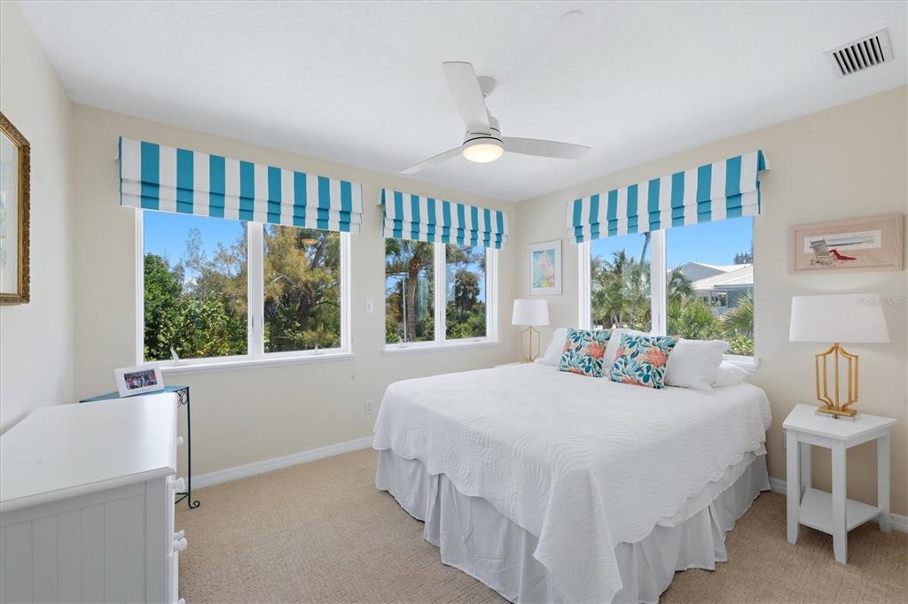 400 South Gulf Boulevard Boca Grande, FL 33921 - Photo 42 of 80 a bedroom with a bed and a large window