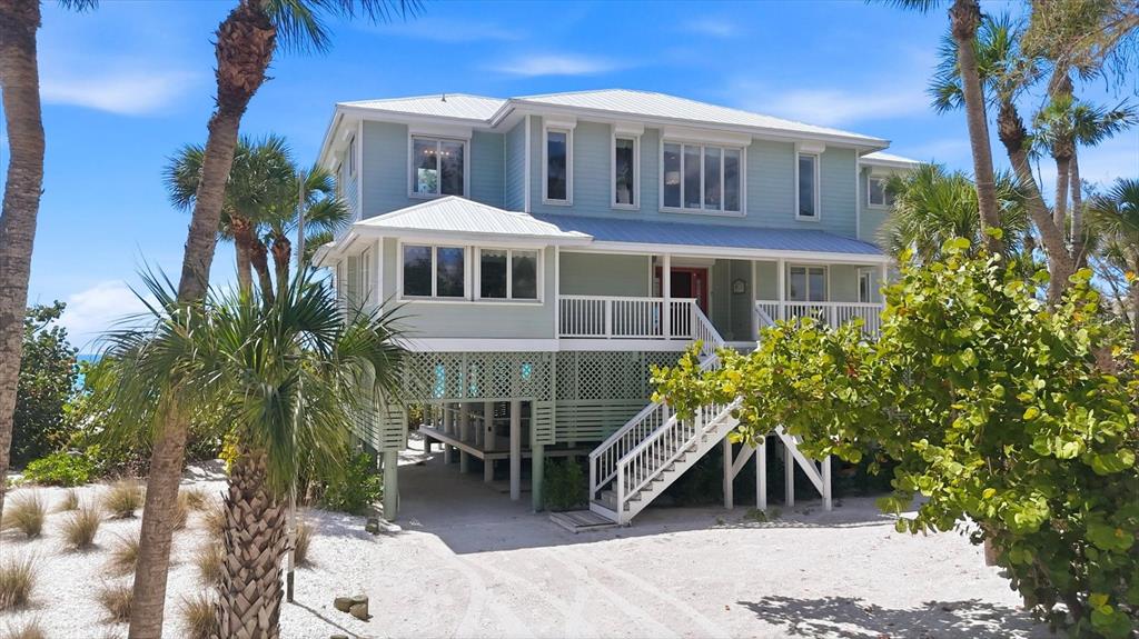 400 South Gulf Boulevard Boca Grande, FL 33921 - Photo 5 of 80 a front view of a house with a yard
