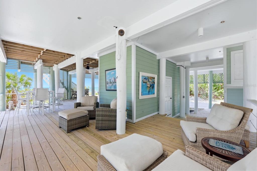 400 South Gulf Boulevard Boca Grande, FL 33921 - Photo 56 of 80 a bedroom with furniture and wooden floor
