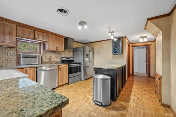a kitchen with a refrigerator sink and cabinets