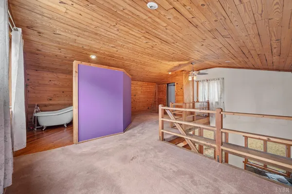 a view of an empty room and a window