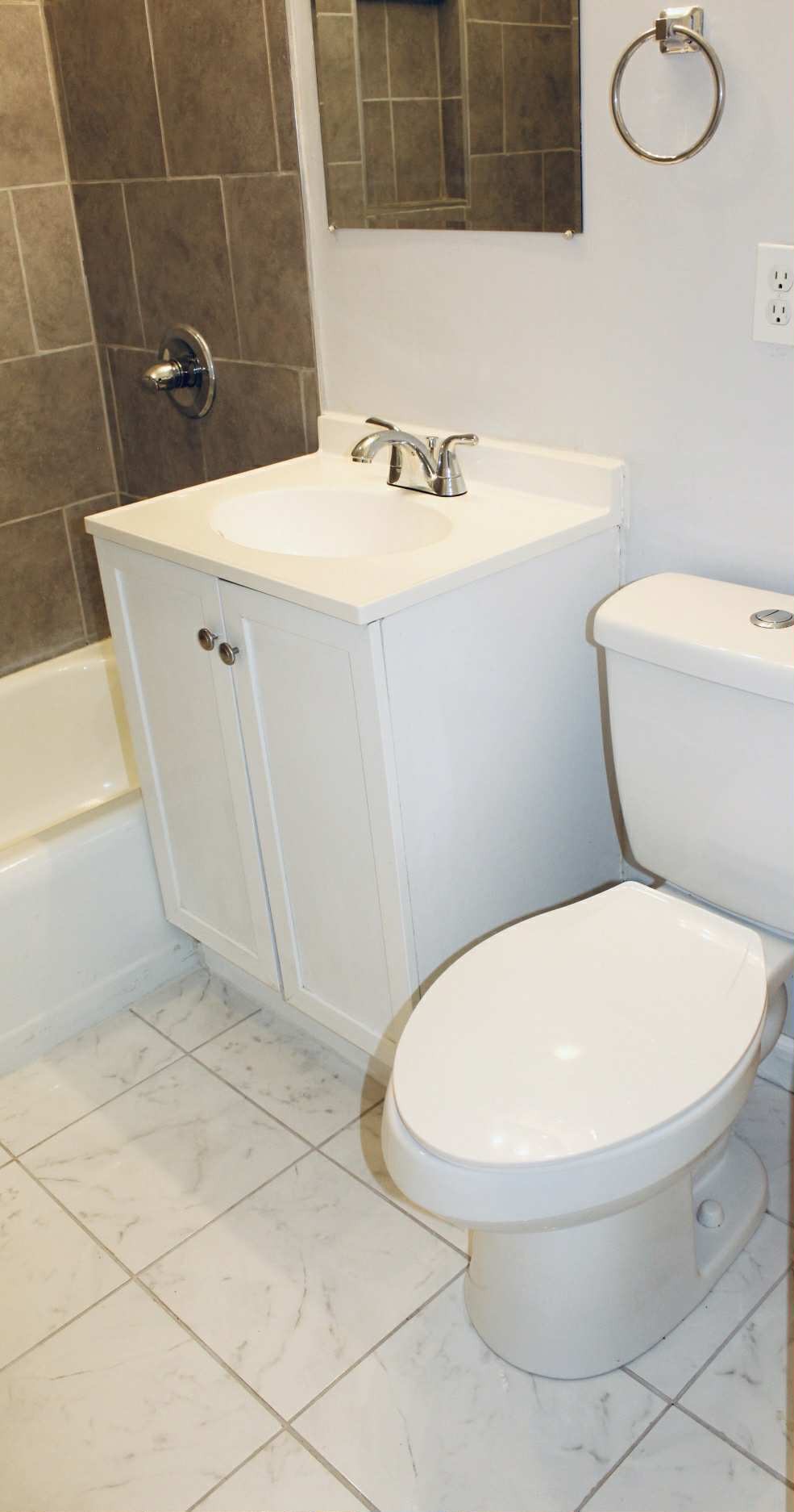 221 Burch Road Clarksville, TN 37042 - Photo 11 of 29 a bathroom with a sink a toilet and mirror