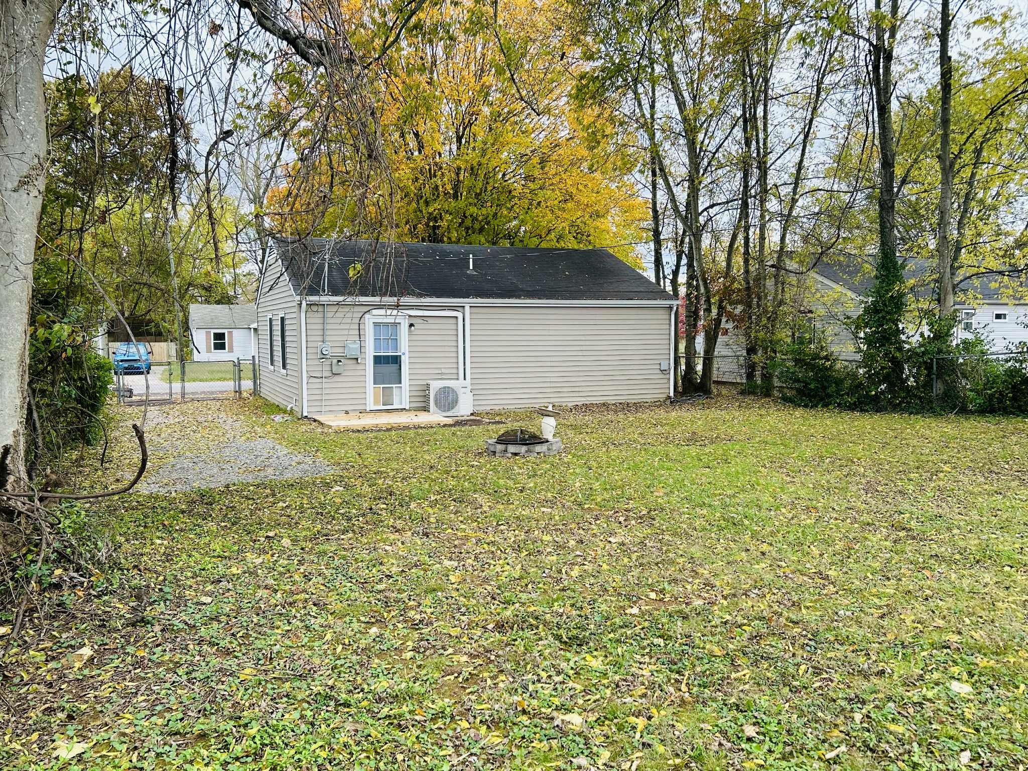 221 Burch Road Clarksville, TN 37042 - Photo 22 of 29 a white house that has a tree in front of it
