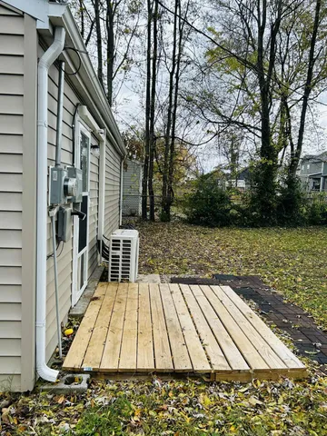 a view of a house with a backyard