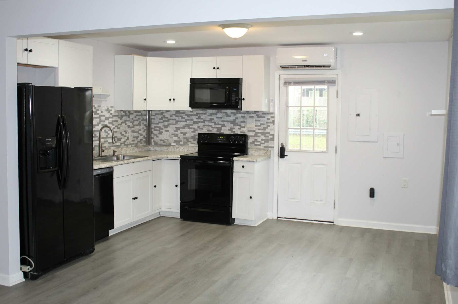 221 Burch Road Clarksville, TN 37042 - Photo 8 of 29 a kitchen with a refrigerator stove and microwave