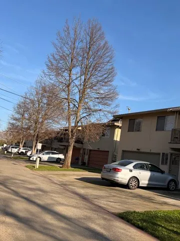 a view of street with parked cars