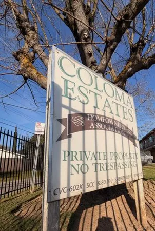 a sign on a pole on a street