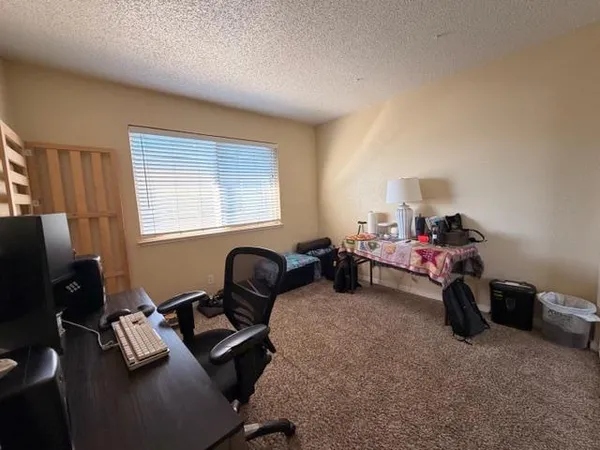 a room with furniture and a window
